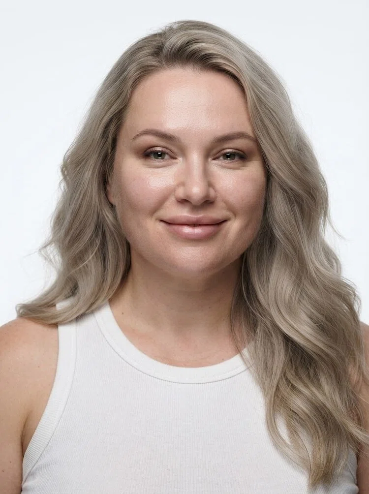 Young female fashion model with long wavy ash blonde hair, close-up.