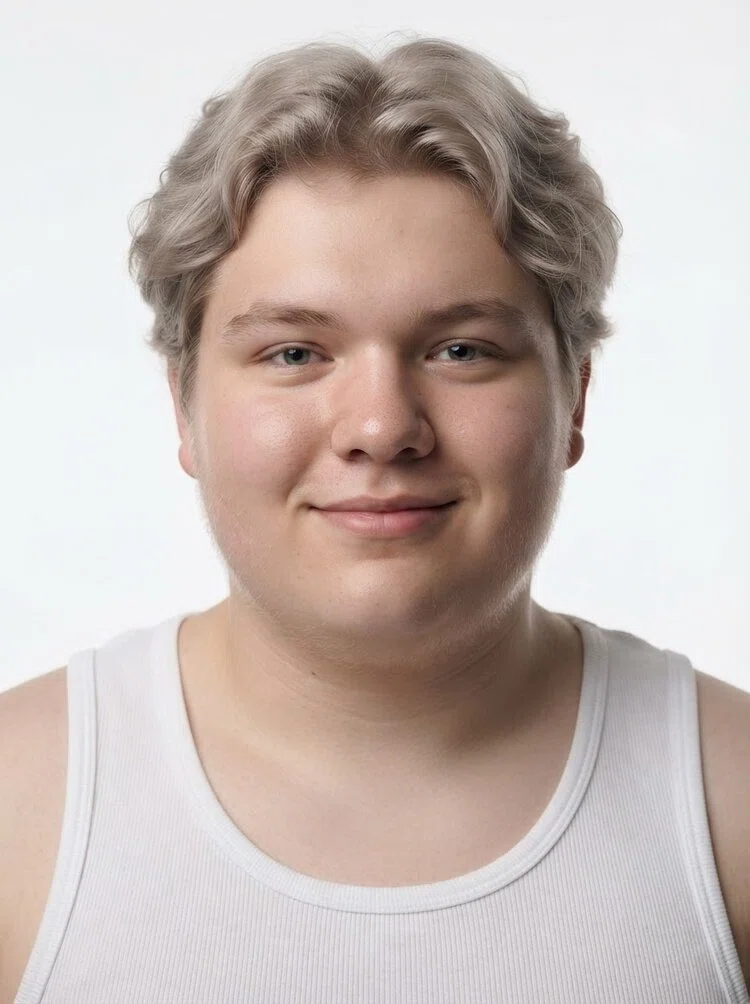 Young male fashion model with short wavy ash blonde hair, close-up.