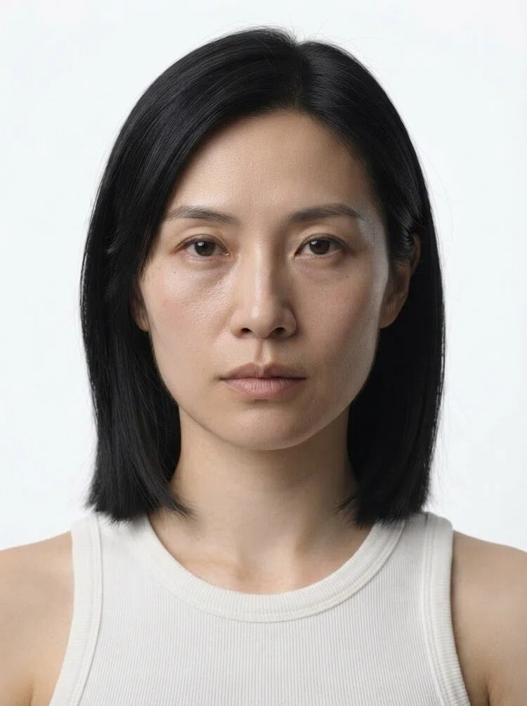Middle-aged female fashion model with shoulder-length black hair