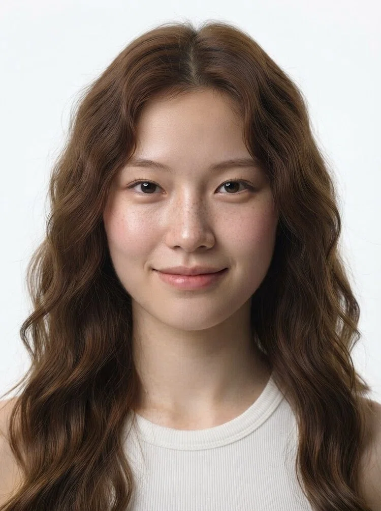 Young female fashion model with long chestnut brown wavy hair