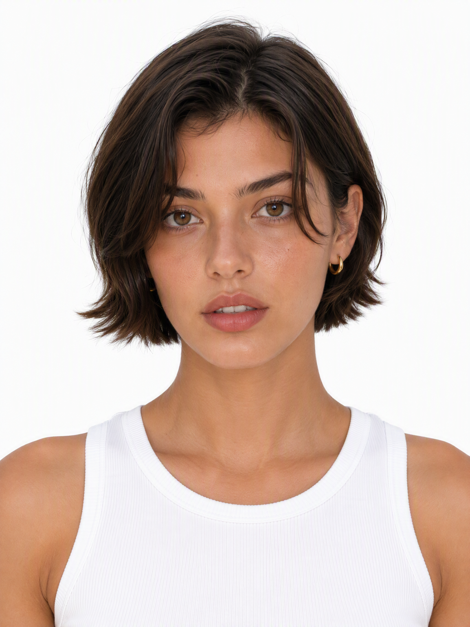 Young female fashion model with a short, chin-length dark brown bob with face-framing layers.